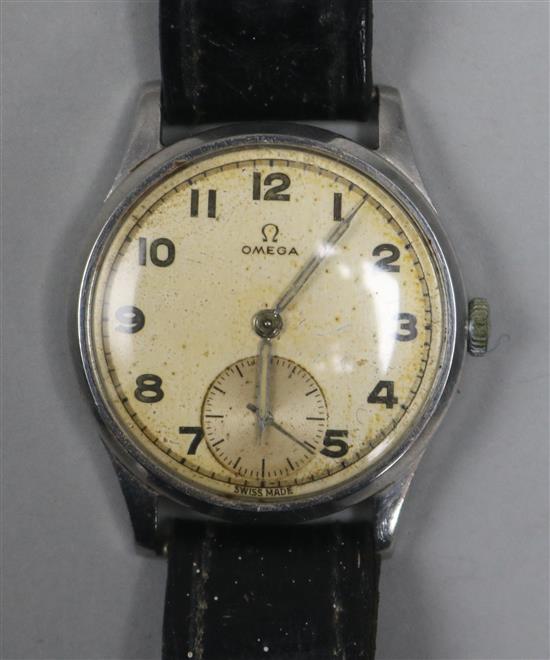 A gentlemans late 1940s stainless steel Omega manual wind wrist watch.